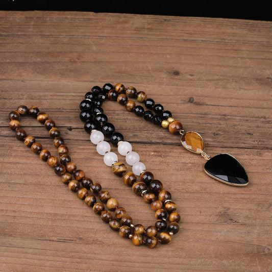 Spiritual statement necklace featuring black agate, tiger eye, and white agate