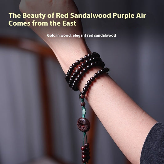 Talisman bracelet with jade and red beads worn for success and protection.