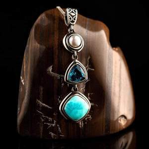 Amulet with pearl, blue crystal, and larimar stones for emotional balance and feminine power