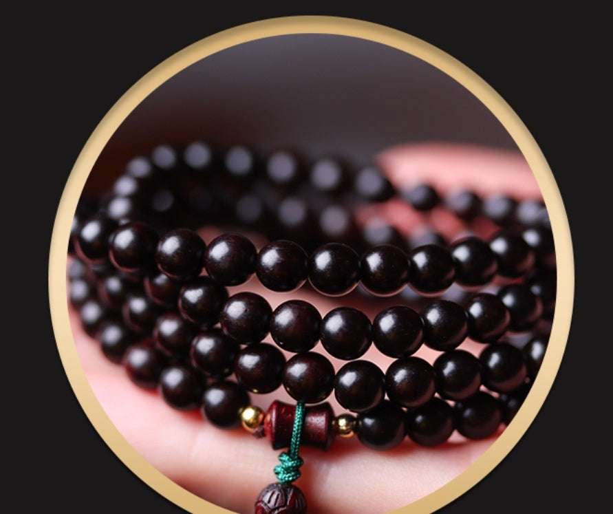 Close-up of talisman beads, jade and deep red for spiritual energy and meditation
