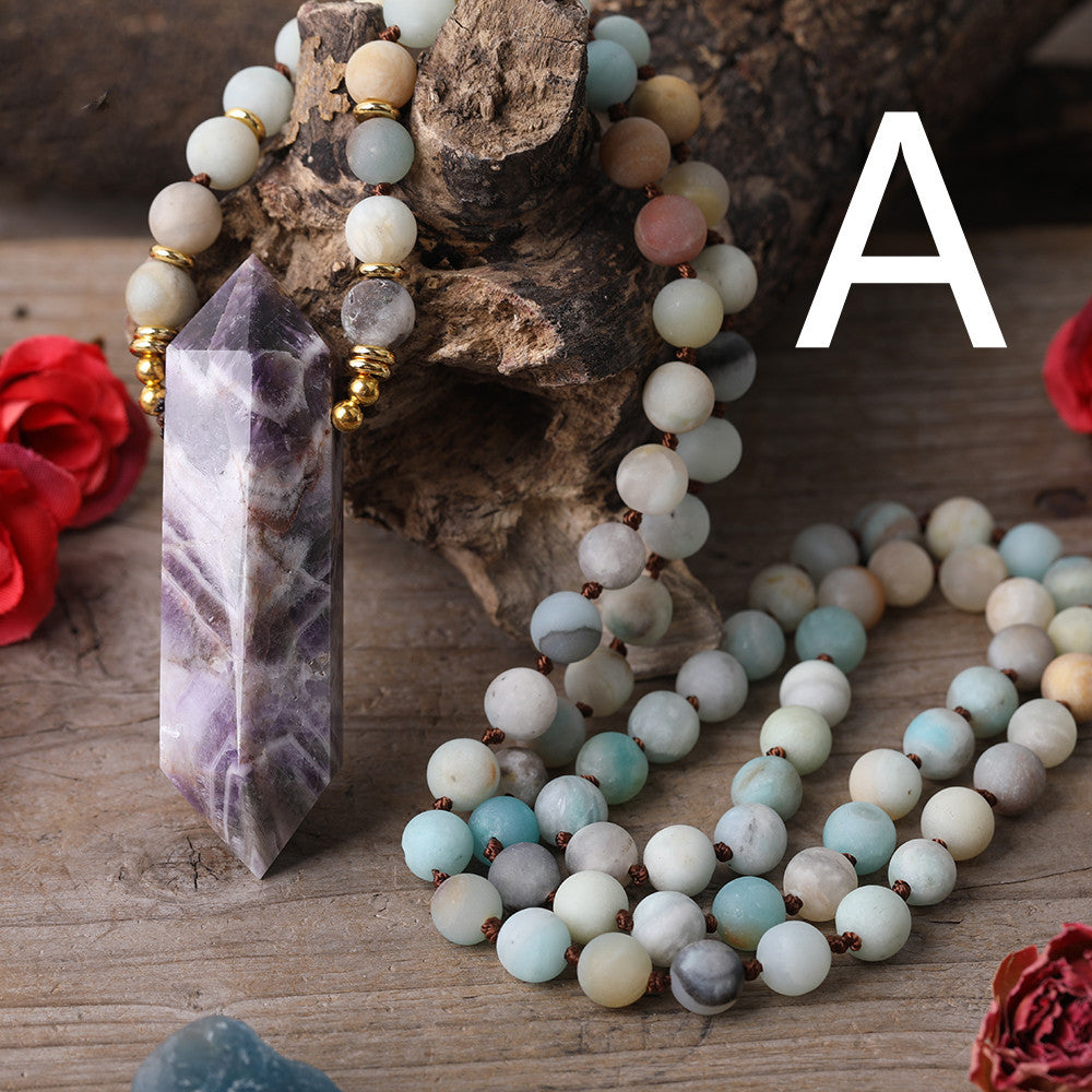 Handmade necklace featuring chevron-patterned amethyst and  quartz crystals