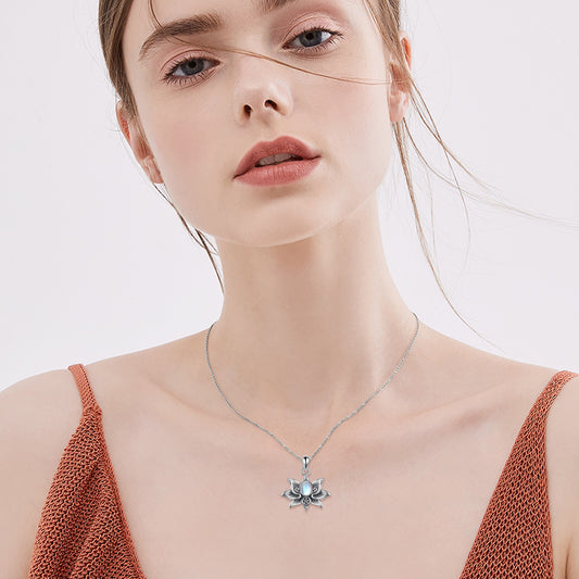 Sterling silver lotus pendant featuring a glowing moonstone and pentacle symbol