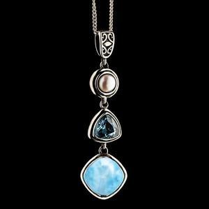 Handcrafted pendant with healing stones: pearl, topaz, and larimar for inner peace